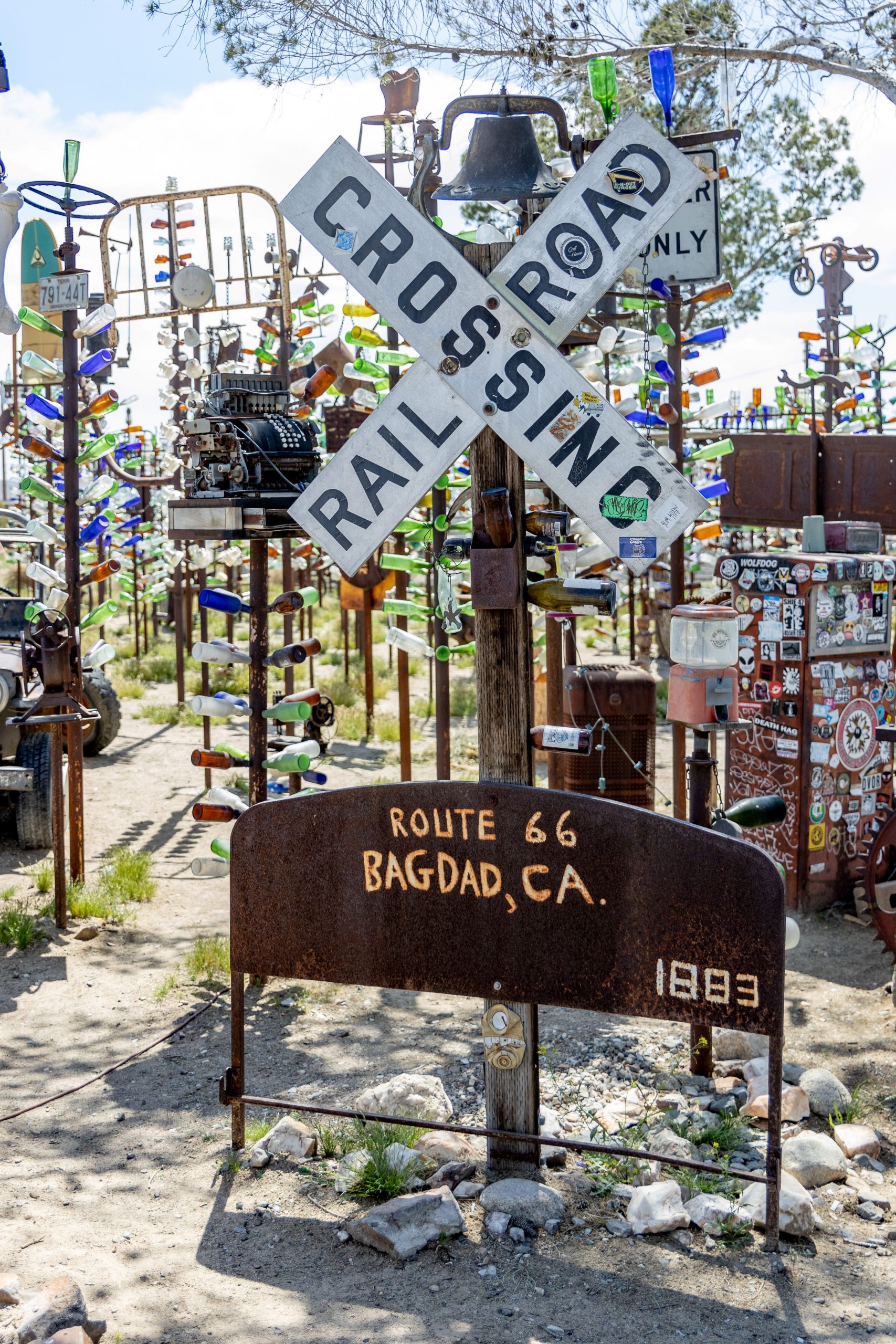 1M3A5957 - Bruce Herwig Metal sculptures, a Railroad Crossing sign, and a Route 66 Bagdad, CA sign dated 1893.