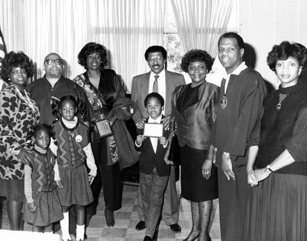 Dr. Ruth Johnson president of the Rialto Black Culture Society presents Dr. Maulana Karega, creator of Kwanzaa, 1995