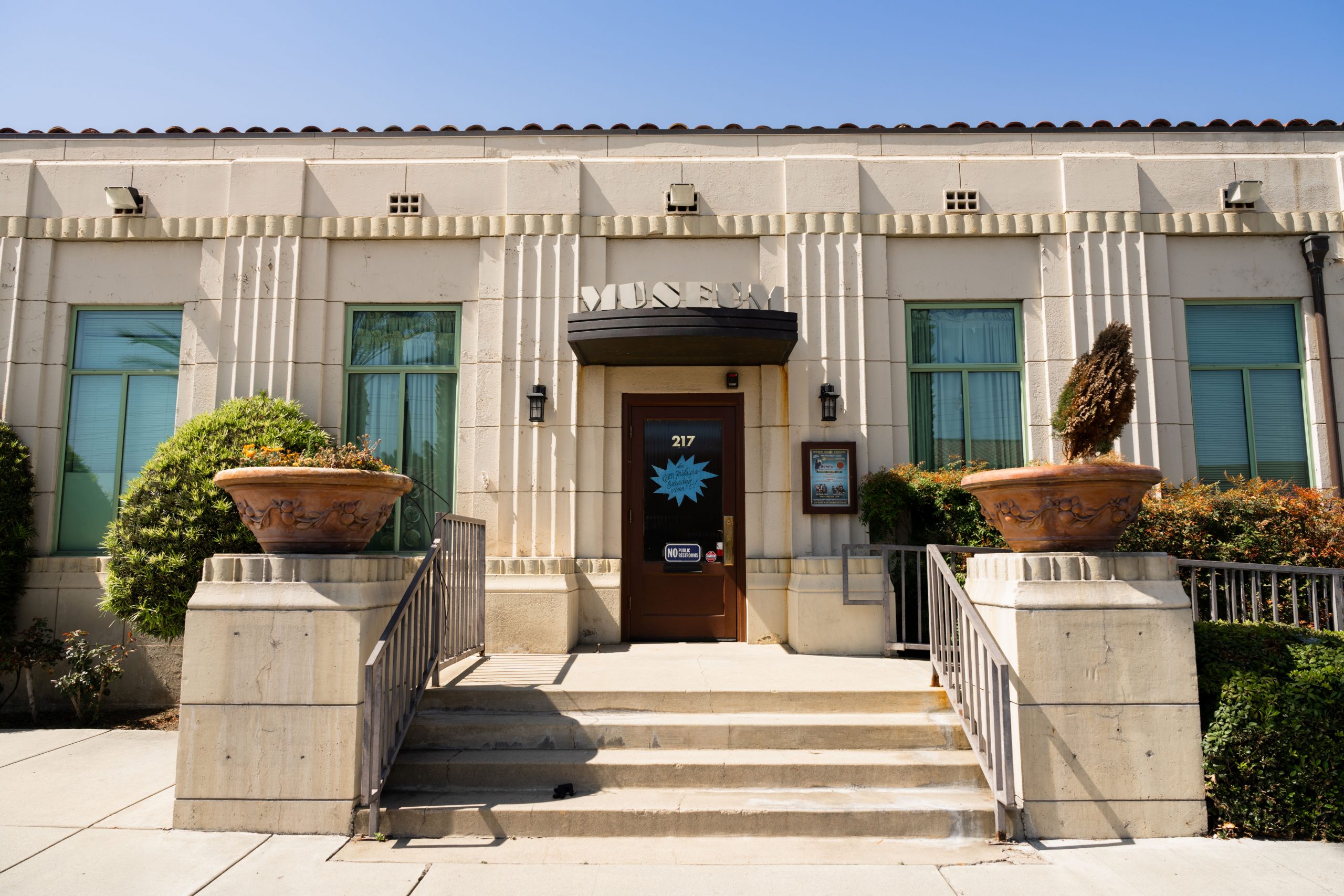 A photo of an art deco building that says Mueum in Old Town Upland.