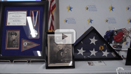 WWII photo, flag and war medal and high school diploma of Marvin N. Minter.