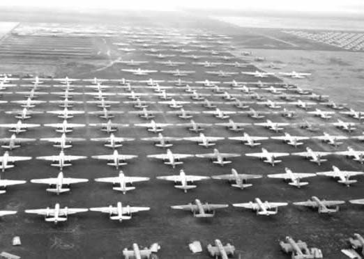 WWII planes in a field.