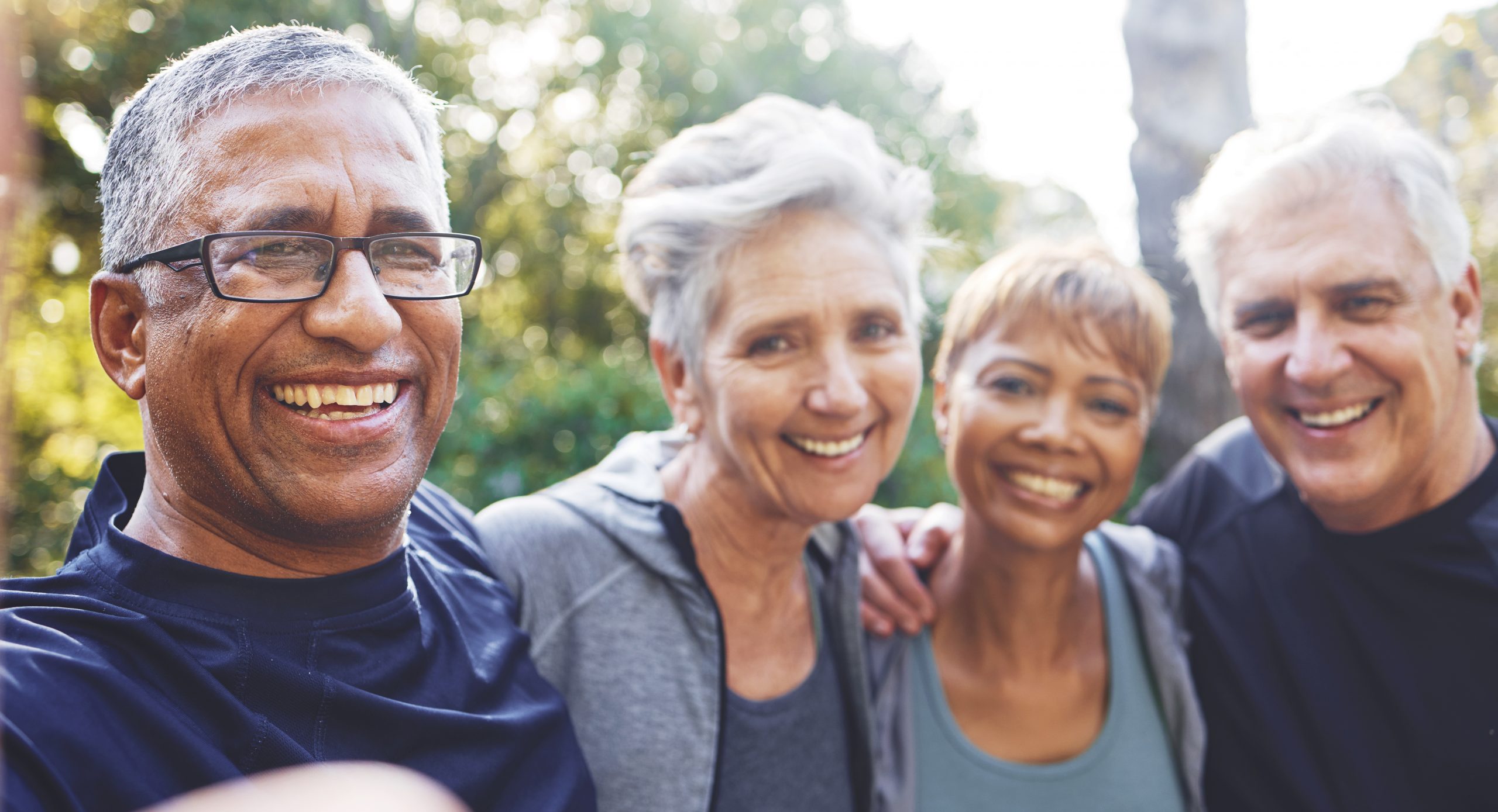 Nature, selfie and senior friends on a hike for wellness, exercise and health in the woods. Happy, smile and portrait of a group of elderly people in retirement in forest trekking together in summer