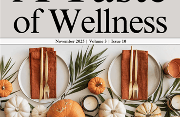 A holiday meal table setting with pumpkins with “A Taste of Wellness” magazine November 2025 | Volume 3 | Issue 10 cover.