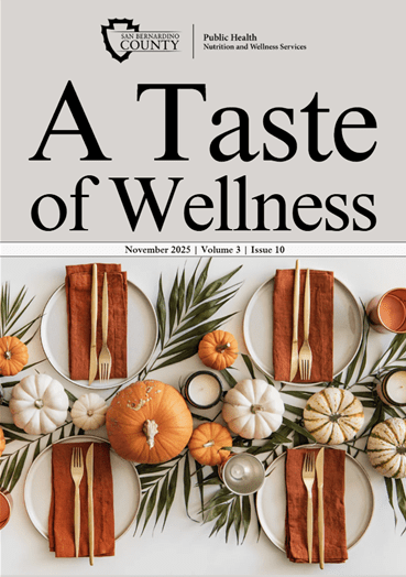 A holiday meal table setting with pumpkins with “A Taste of Wellness” magazine November 2025 | Volume 3 | Issue 10 cover.
