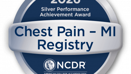 The image shows a circular silver and blue badge. At the top, it says "2026 Silver Performance Achievement Award." The center text reads "Chest Pain – MI Registry."