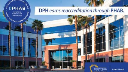 Exterior of County Public Health building with overlay text announcing PHAB reaccreditation and county logo.