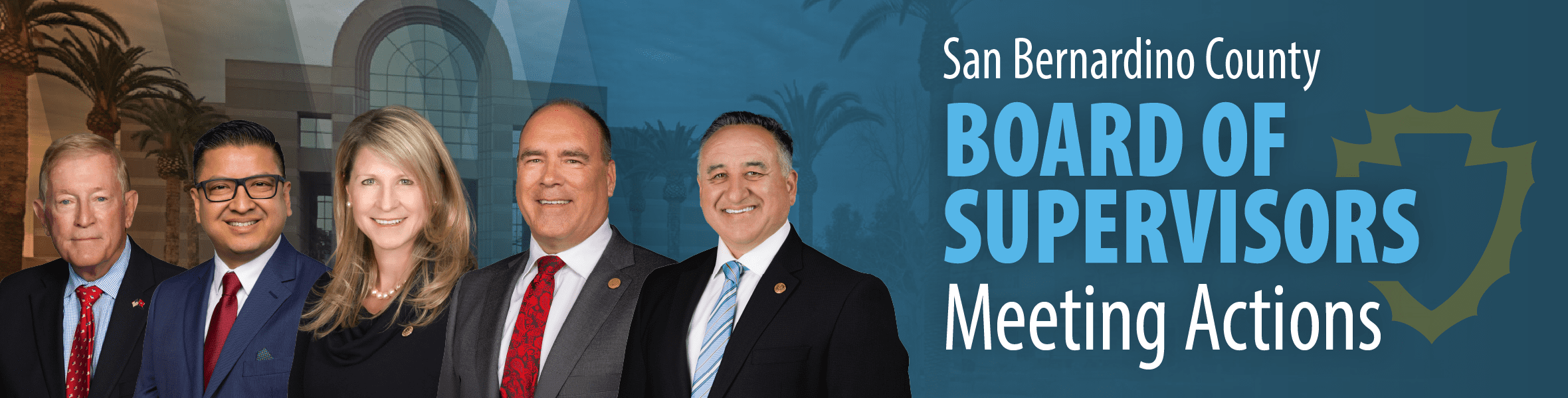 San Bernardino County Board of Supervisors Meeting Actions banner with the county shield emblem, displaying five supervisors in professional suits, smiling in front of a backdrop featuring the San Bernardino County Government Center building with palm trees.