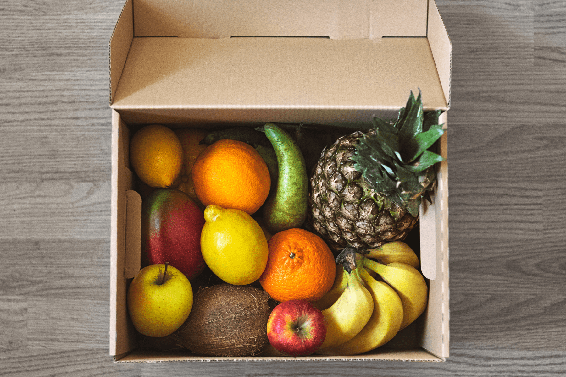 A shipping box of tropical fruit.
