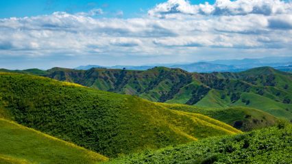 Rolling hills under a blue sky.