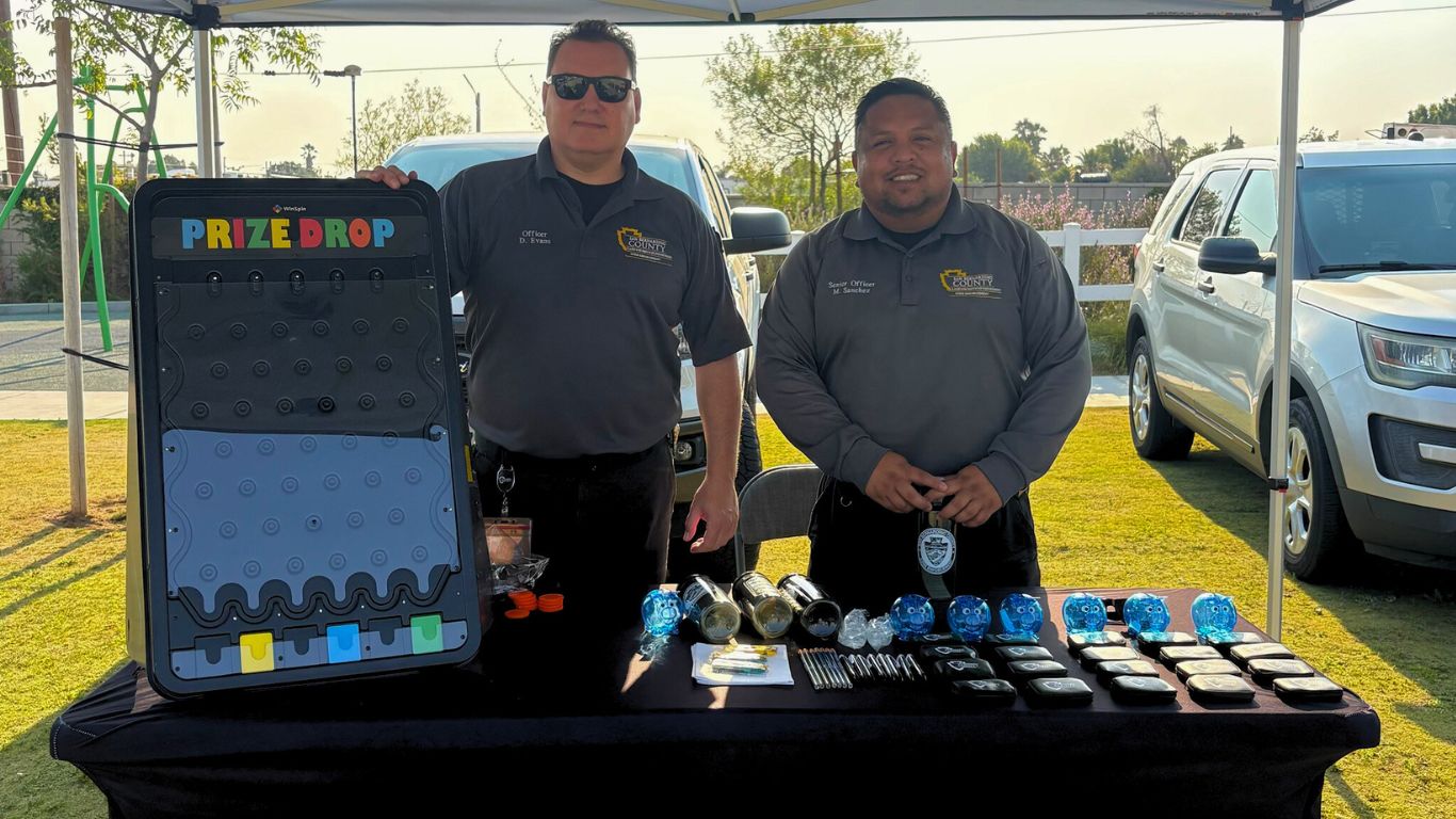 Two Code Enforcement Officers set up a booth at the National Night Out event held in Bloomington, where they distributed souvenirs and informational pamphlets to residents.