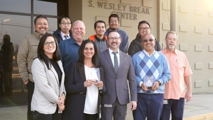 Public Works team members proudly display their APWA awards for the High-Intensity Activated Crosswalk (HAWK) Beacon System and Oak Glen Road at Birch Creek Culvert Replacement.