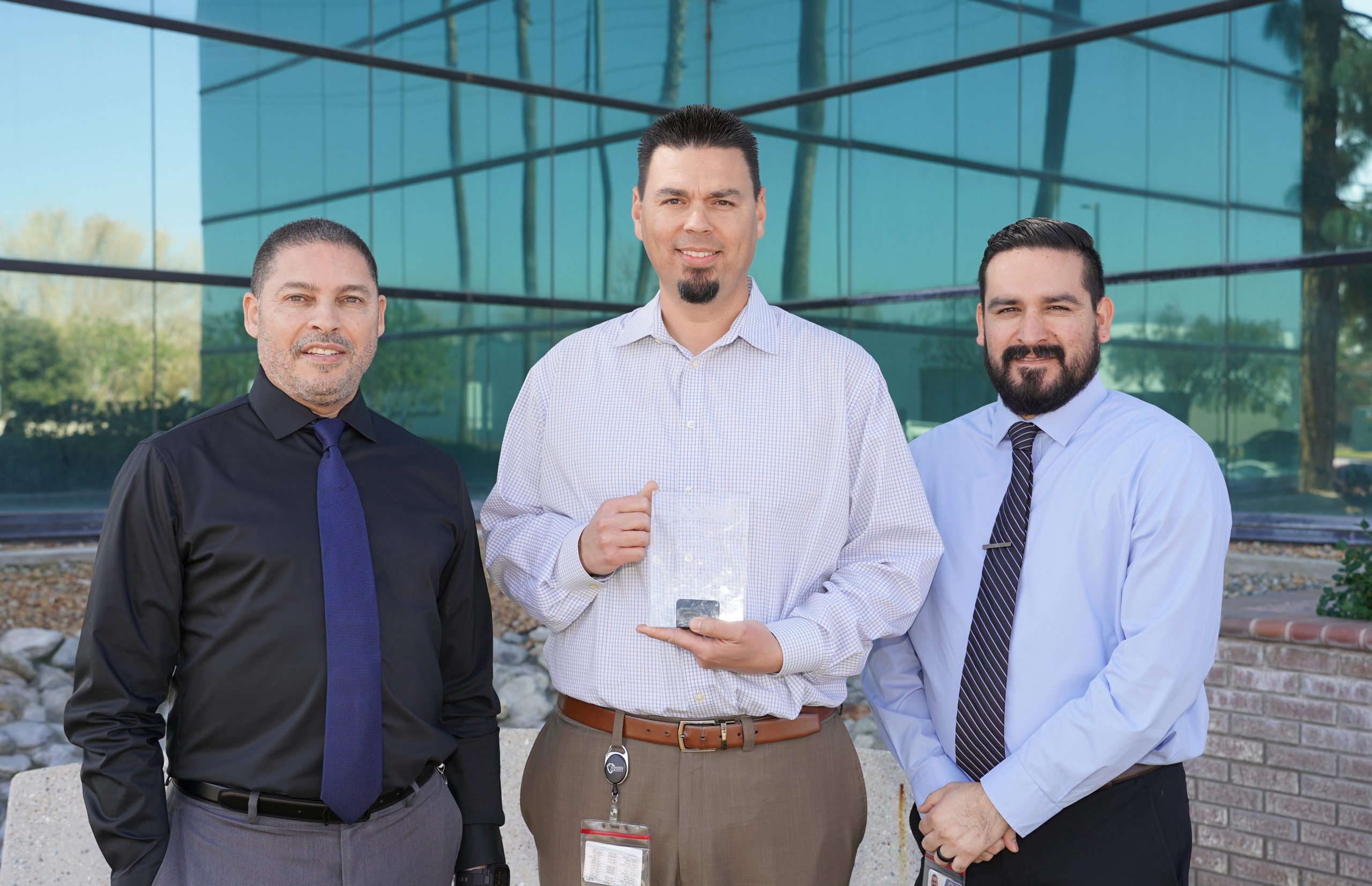 Public Works team members proudly display their APWA awards for the High-Intensity Activated Crosswalk (HAWK) Beacon System and Oak Glen Road at Birch Creek Culvert Replacement.