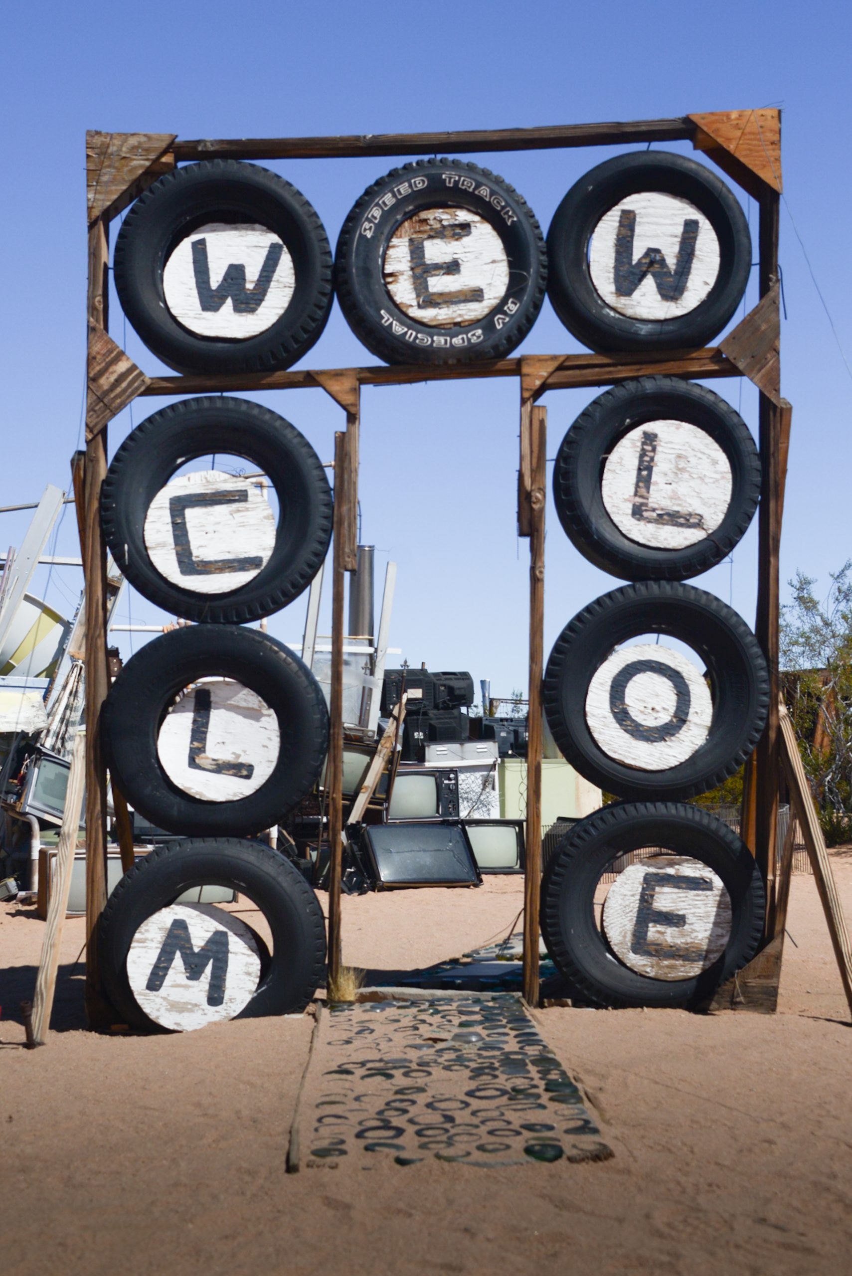 View of the Noah Purifoy's Outdoor Desert Art Museum exhibit featuring a metal sculpture.
