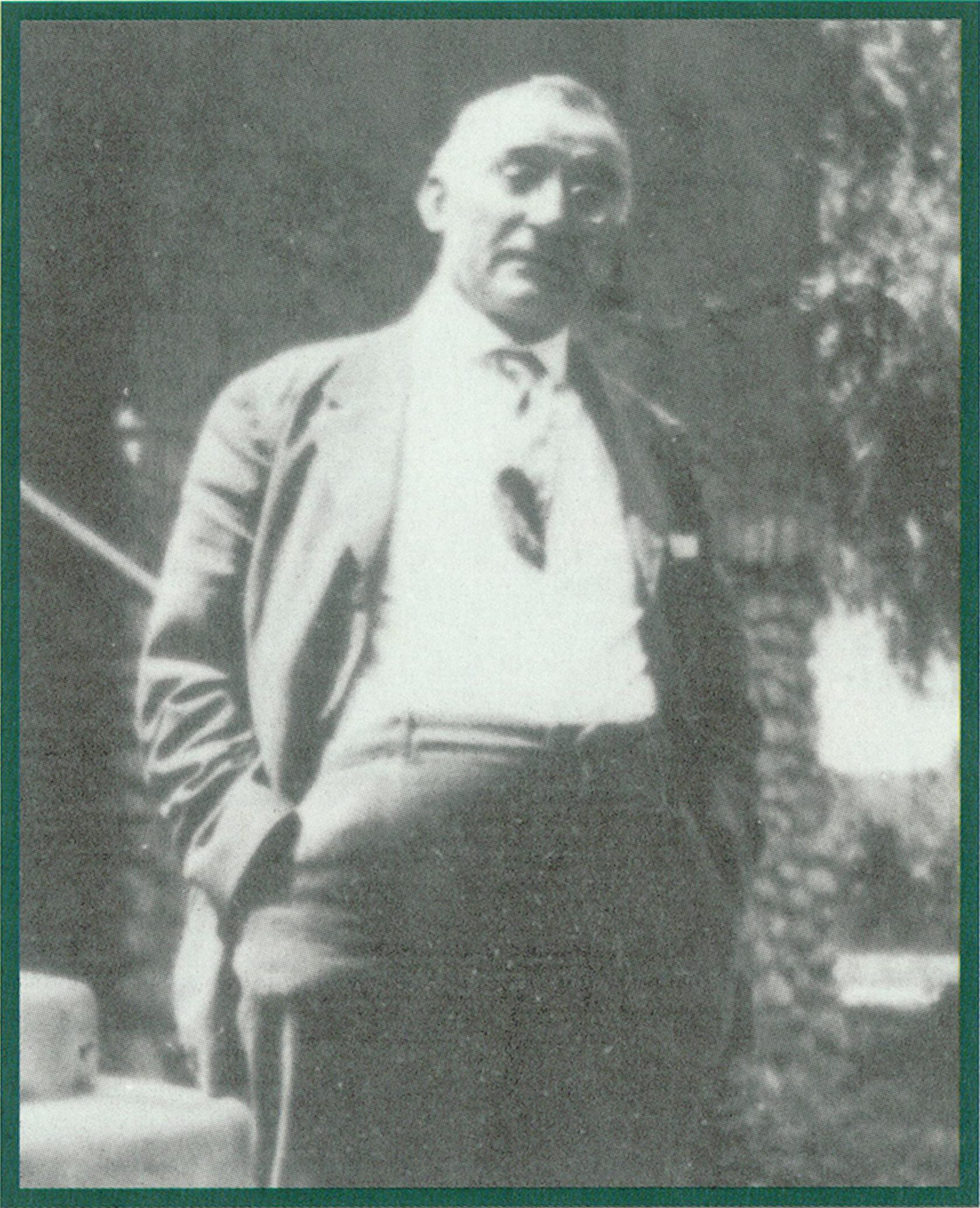 Black and white photo of Dr. William Howard Craig standing outdoors.
