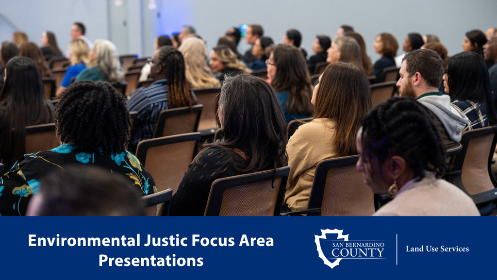 Community members attend a public meeting on Environmental Justice Focus Areas. Blue banner reads “Environmental Justice Focus Areas” with San Bernardino County and Land Use Services logos.