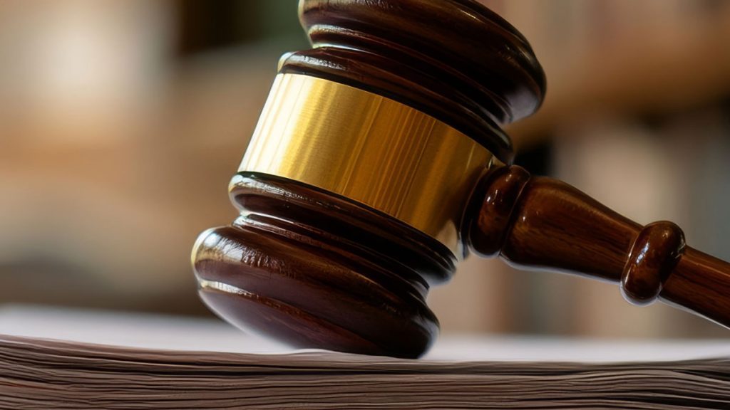 Gavel rests on a stack of legal documents