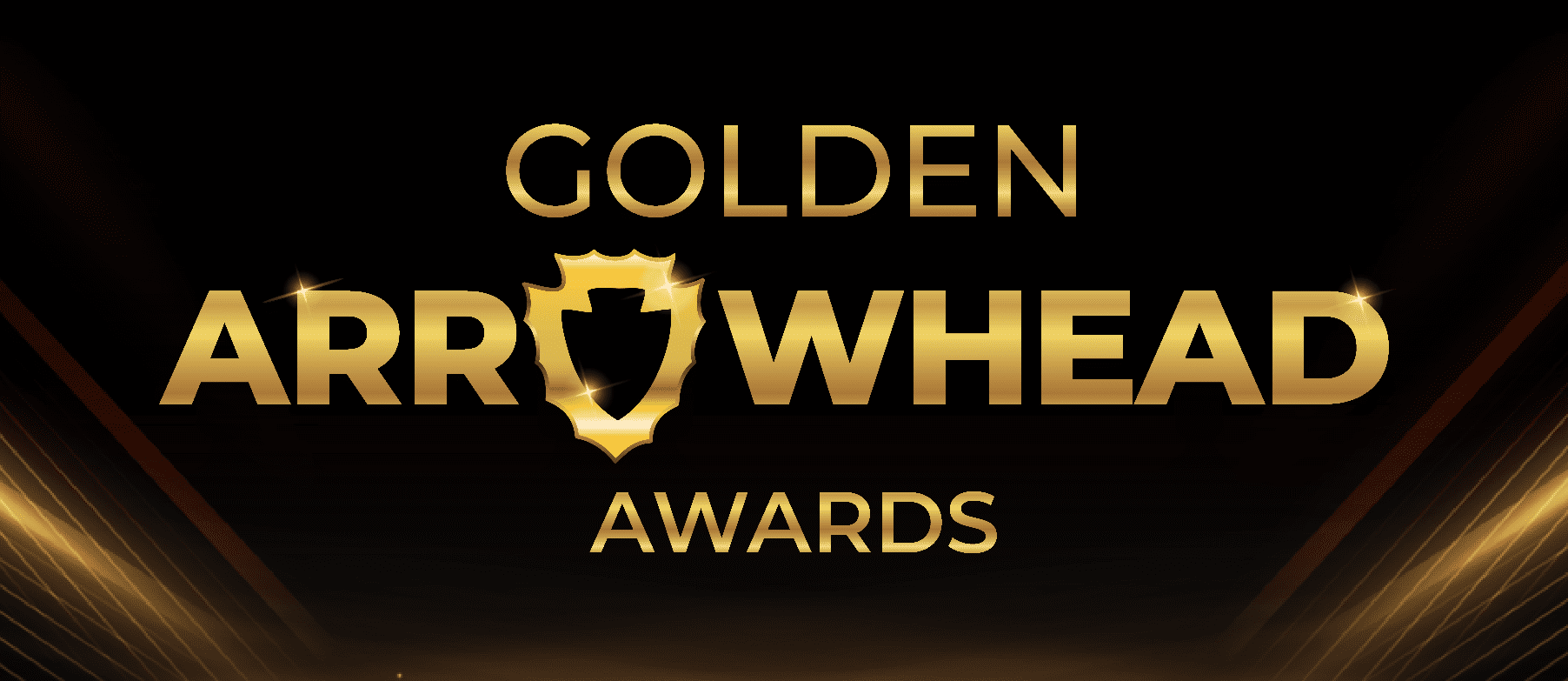 Gold “Golden Arrowhead Awards” text with arrowhead replacing the “o” in “Arrowhead” and light beams in background.