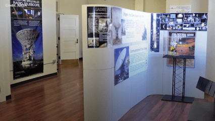 An exhibit featuring informational displays about space exploration at the Goldstone Deep Space Communications Complex.