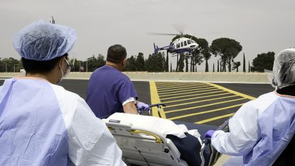 ARMC medical staff prepares to treat a patient arriving in a medical helicopter, illustrating the hospital’s Level I trauma care for critically ill and injured patients.