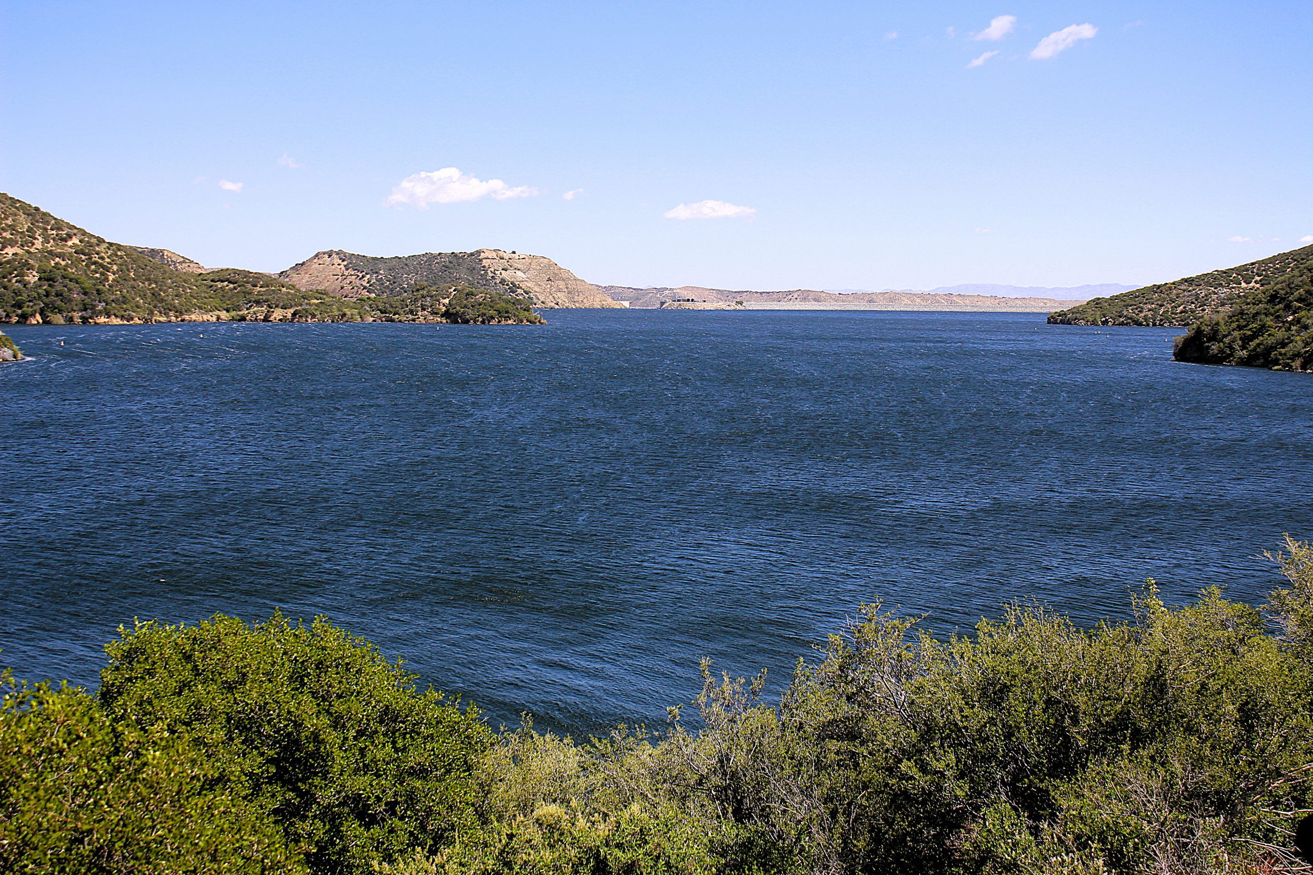 A lake with mountains in the background.