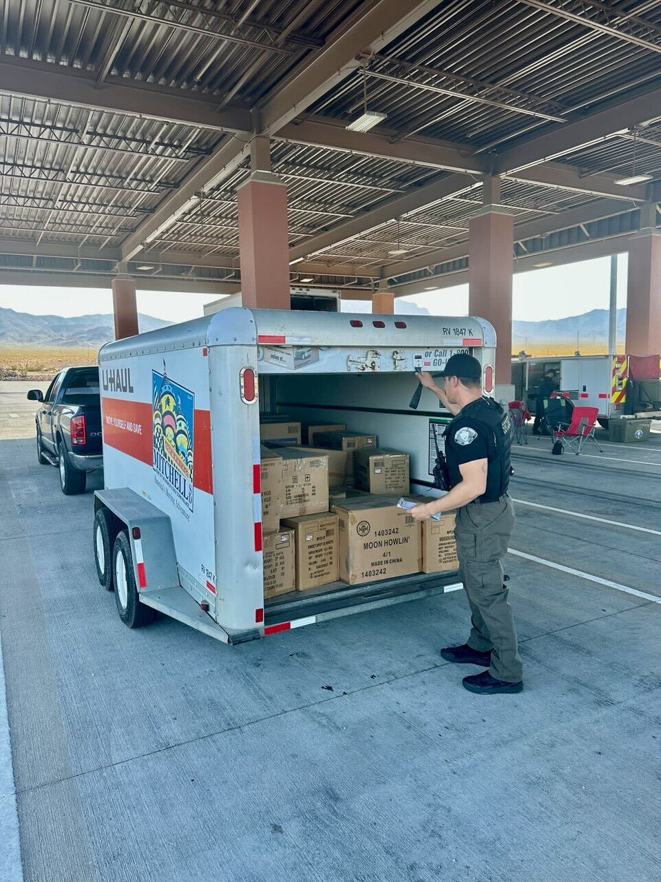 San Bernardino County Fire investigators uncover a U-Haul trailer loaded with boxes of illegal fireworks during a roadside interdiction operation.