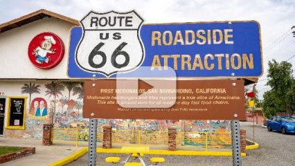 Route 66 Roadside Attraction sign at the site of the first McDonald's in San Bernardino. The sign includes historical information about McDonald's hamburgers and fries.