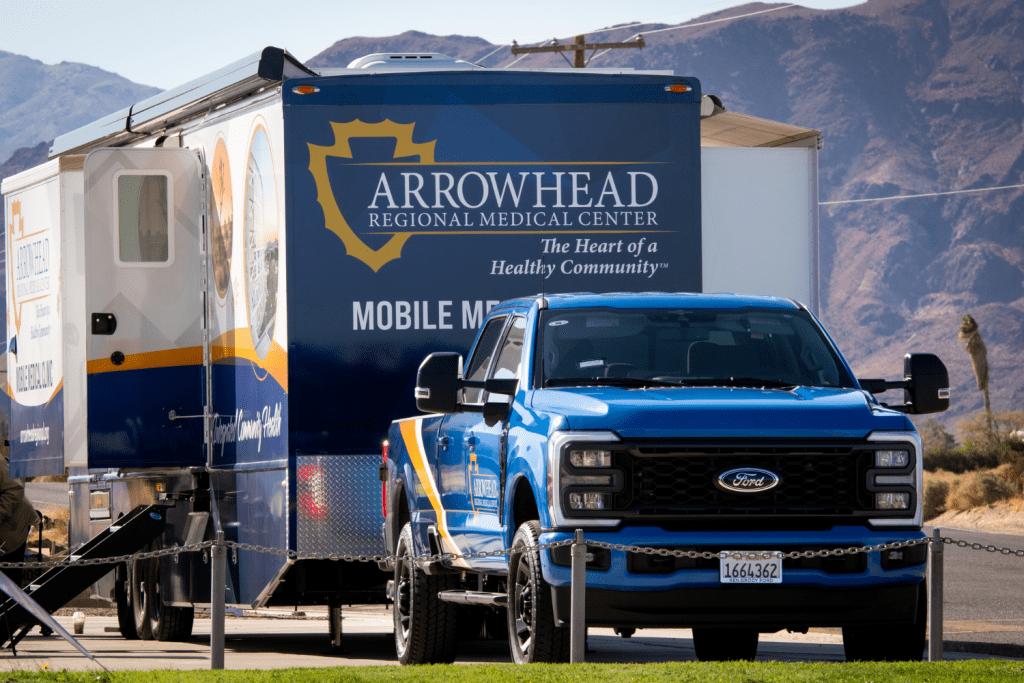 A Ford truck towing Arrowhead Regional Medical Center’s Mobile Medical Clinic unit, which provides health care services to communities and remote areas in San Bernardino County. 