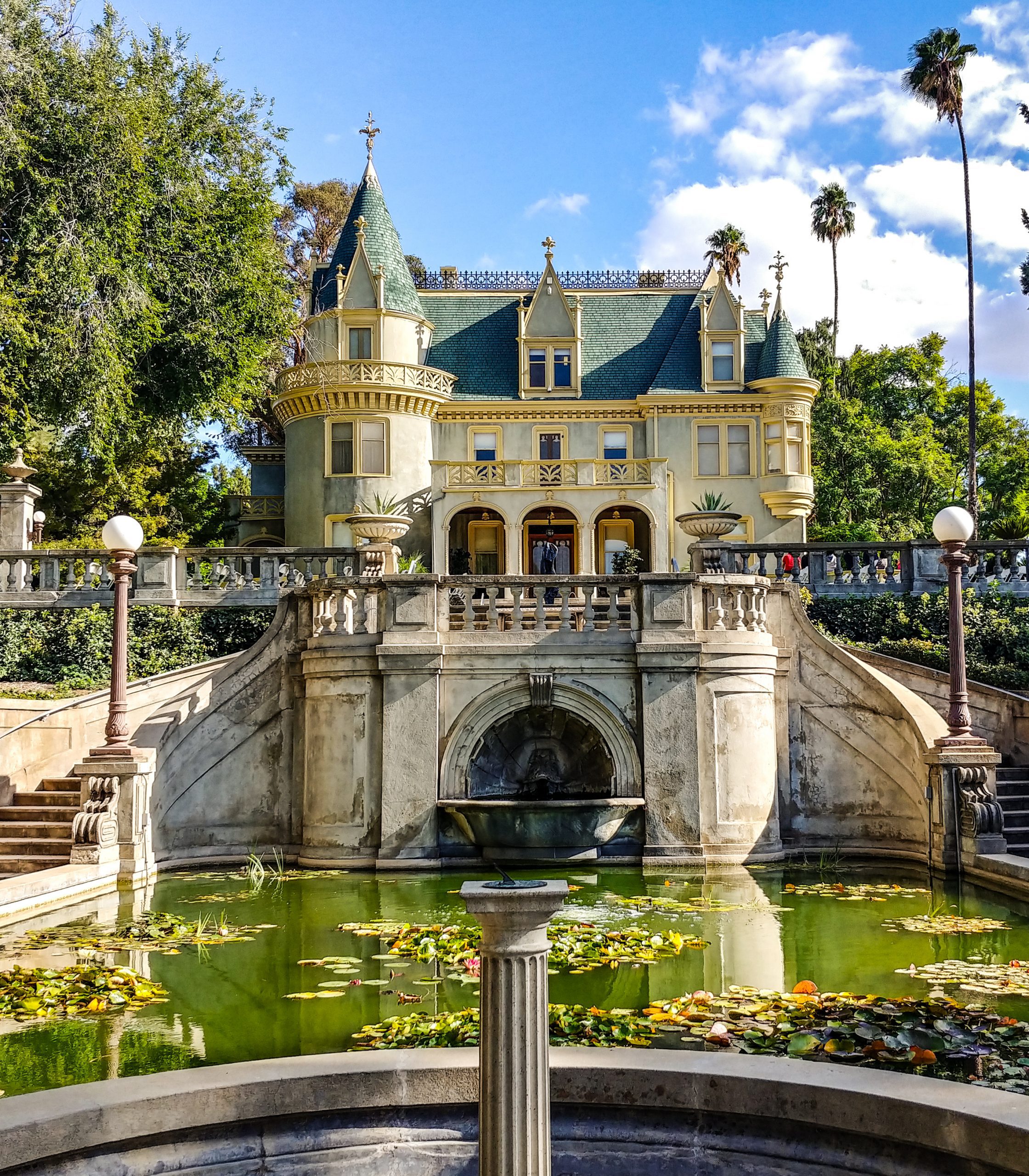View of the Kimberly Crest House and Gardens with a front pond and lily pads.