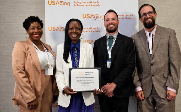  DAAS-Public Guardian staff pose with a USAging Aging Innovations Award at the 2026 conference.