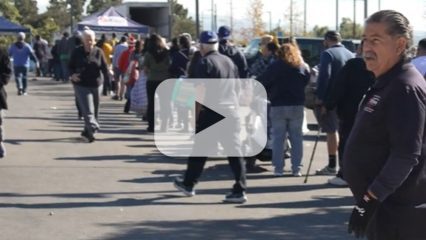 People stand in a long line.