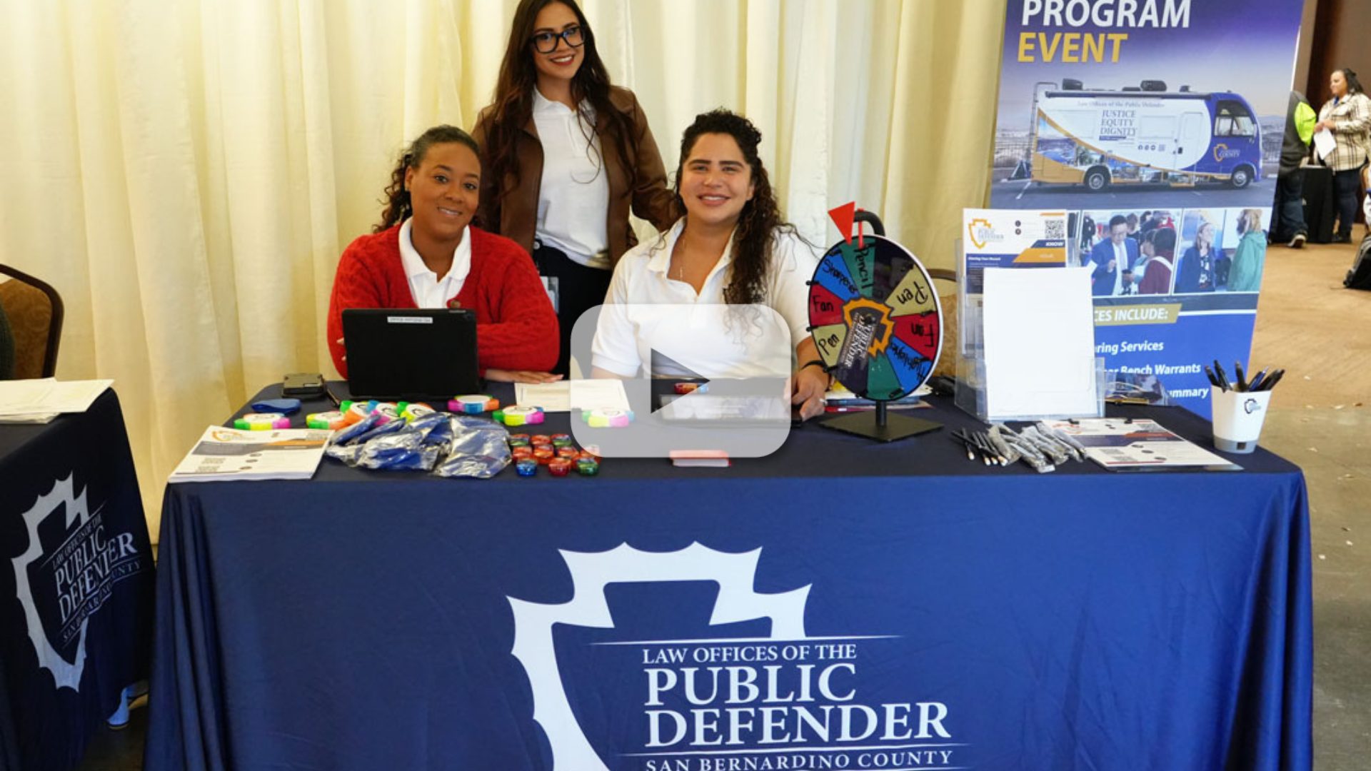 Three female staff sitting at a table.