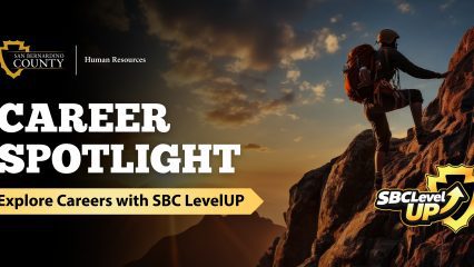 Graphic promoting San Bernardino County Human Resources’ Career Spotlight with SBC LevelUP, featuring a rock climber on a mountain at sunset.