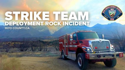 Parked fire truck on a dirt road with mountains in the background. Text reads "Strike Team Deployment Rock Incident, Inyo County, CA." County Fire logo also visible.