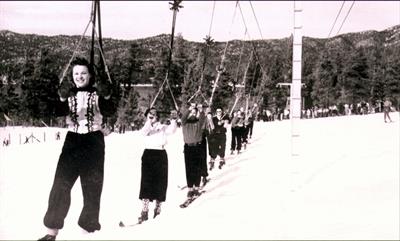 A black and white photo of a group of people skiing at Big Bear.