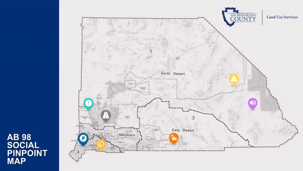 Map of San Bernardino County, colored pins marking truck route concerns, blue “AB 98 Social Pinpoint Map” sidebar, and Land Use Services logo.
