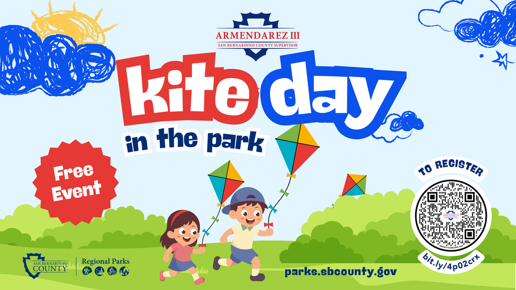 Colorful Kite Day in the Park graphic featuring two children running with colorful kites across a grassy park. Text indicates free event with San Bernardino County Supervisor Armendarez and San Bernardino County Regional Parks logos at the bottom with the URL, parks.sbcounty.gov and a QR code to register.