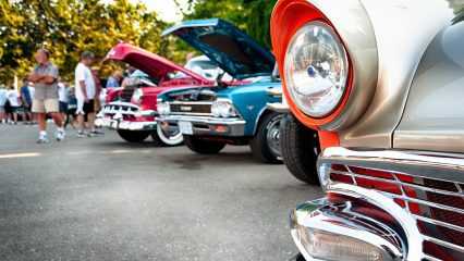 Vintage cars on display at a classic automotive exhibition.