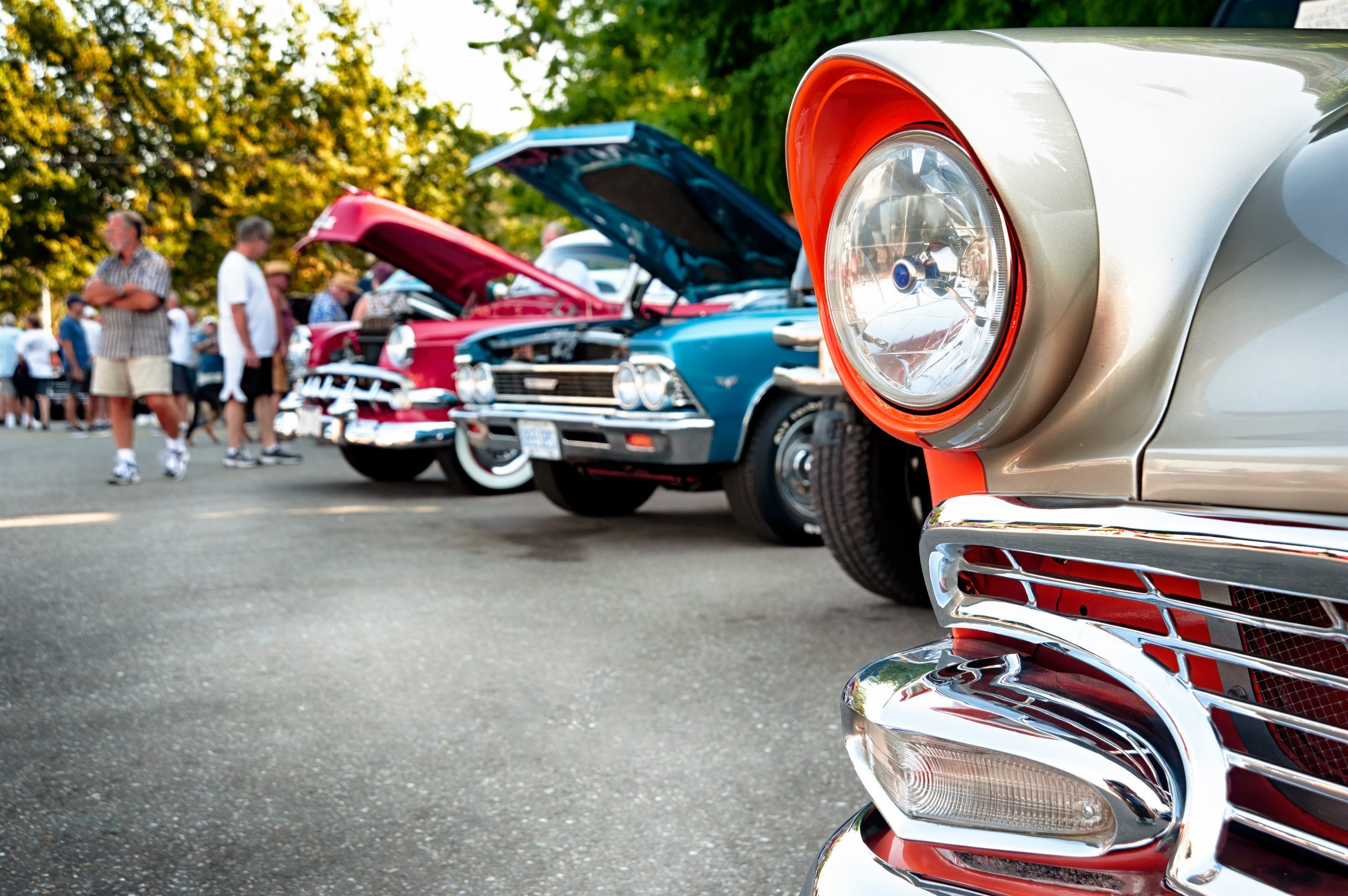 Vintage cars on display at a classic automotive exhibition.