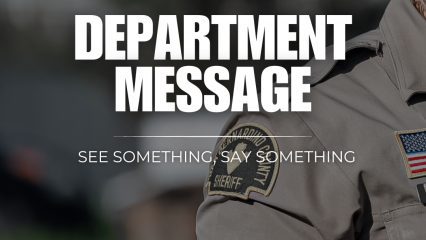 A person wearing a San Bernardino County Sheriff's Department uniform. The image includes text that says, "Department Message" and "See Something, Say Something."