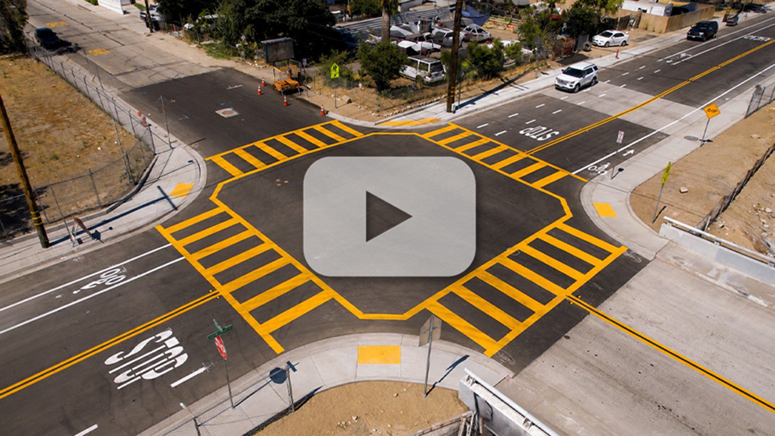 Aerial view of Little Third Street showing new pavement, bright crosswalks, sidewalks, curb ramps and bike lanes.
