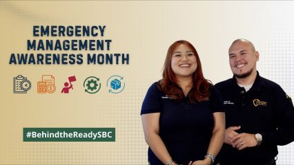 Emergency Management Month graphic with two SBC OES members, preparedness icons, and #BehindTheReadySBC.