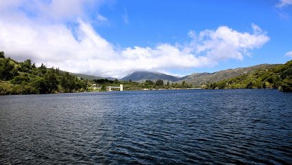 A lake with mountains in the background.