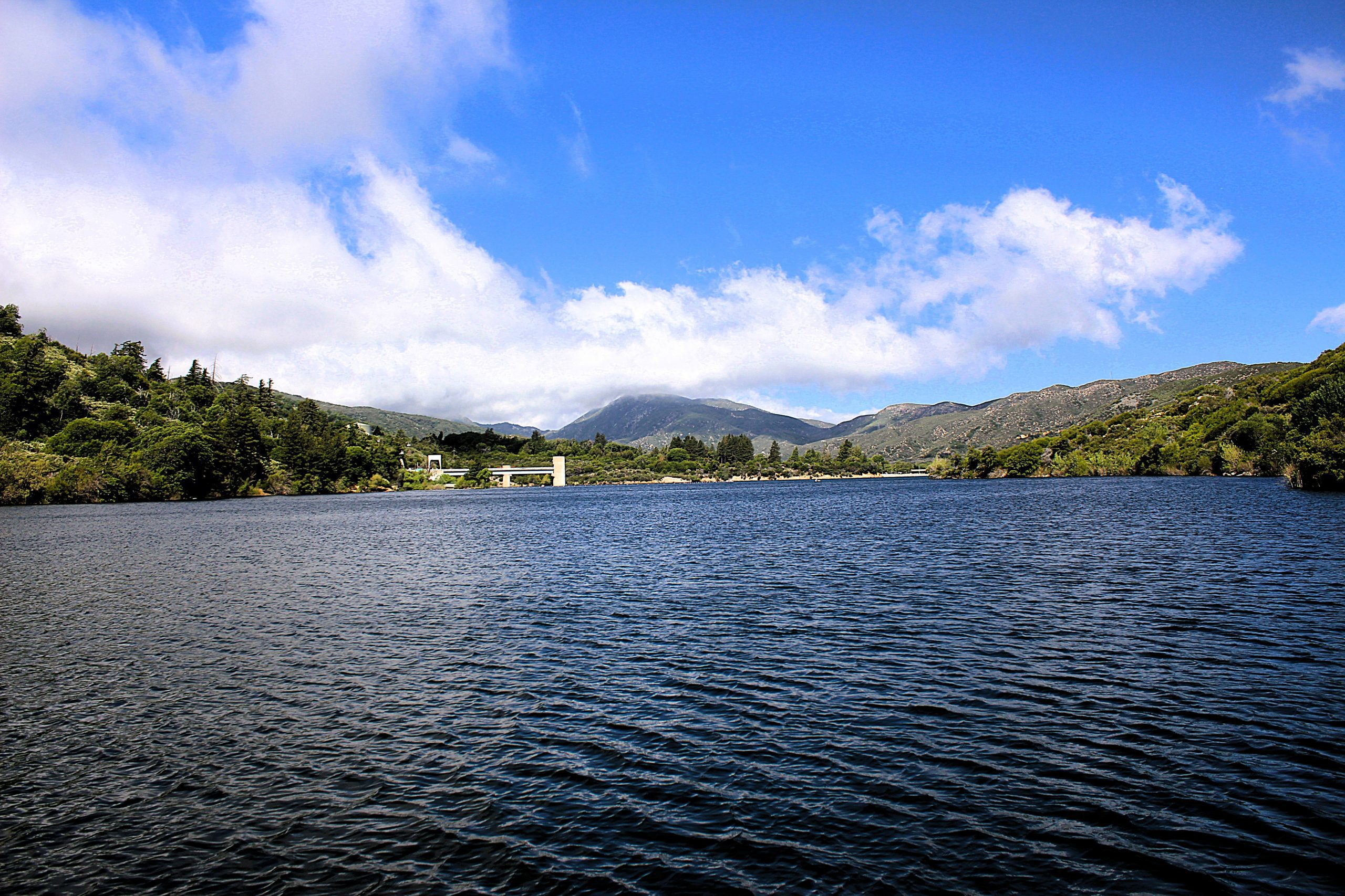 A lake with mountains in the background.
